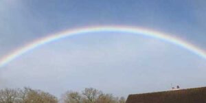Rainbow over house